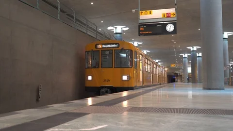 Yellow train in Berlin subway arriving the platform at Bundestag station Stock Footage 119075406