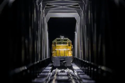 Yellow train on bridge Stock Photos
