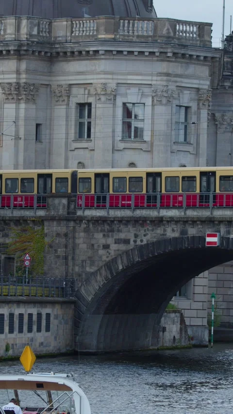 Yellow Train Crossing Bridge Over Spree River in Berlin Stock Footage 321666341