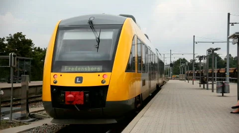 Yellow train leaving station Stock Footage 844820