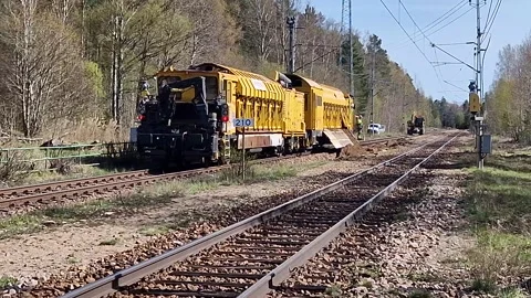 Yellow train track repair machine. Railrad Work Stock Footage 274550982