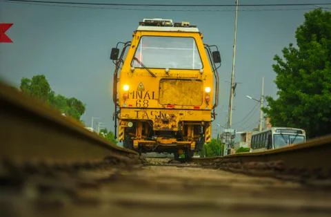 Yellow train on the tracks Stock Photos