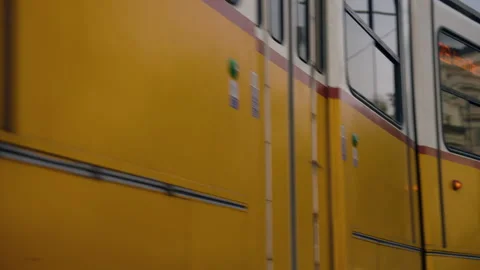 Yellow Tram Across The Streets With A View Of The Gothic Revival Parliament Stock-Footage 323818434