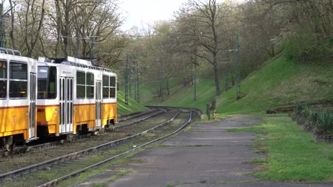 Yellow tram coming from the corner Stock Footage 270318681