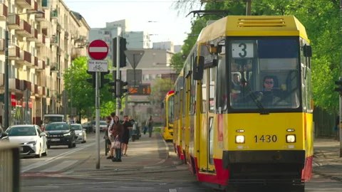 Yellow tram exiting frame, Warsaw Stock Footage 338324858