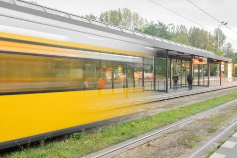 A yellow tram in motion Foto stock