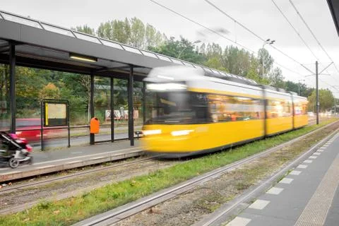 A yellow tram in motion Foto stock