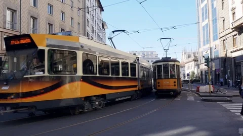 Yellow tram moving through streets in modern city Stock Footage 82852420
