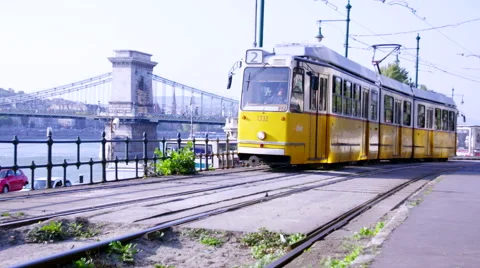 Yellow tram passes by Stock Footage 57187053
