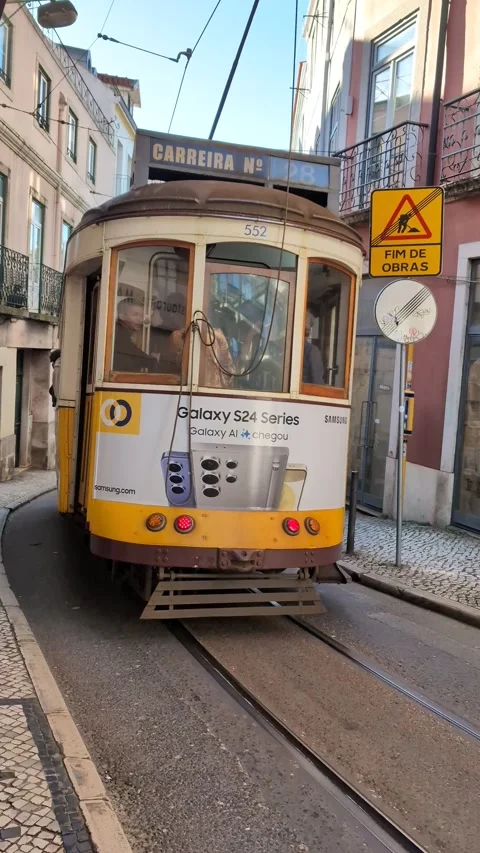 Yellow tram in the streets of Lisbon Stock Footage 274351170