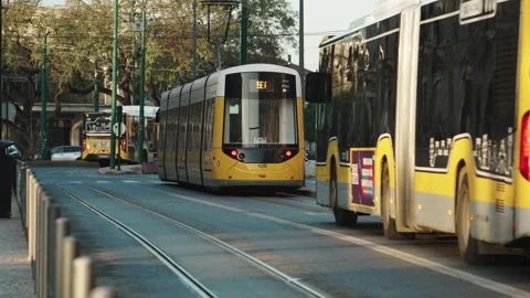 Yellow trams and buses of Lisbon's public transport on the streets of Lisbo.. Stock Footage 272164918