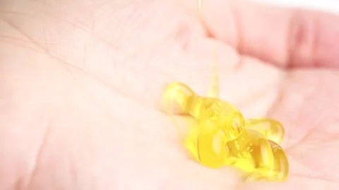 Yellow transparent peeling gel with bubbles pouring into open hand. Skin ca.. Stock Footage 260702837