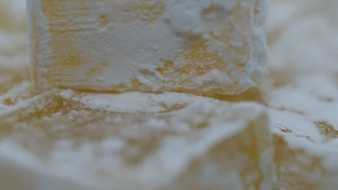 Yellow Turkish delight cubes dusted with powdered sugar. Stock Footage 321642214
