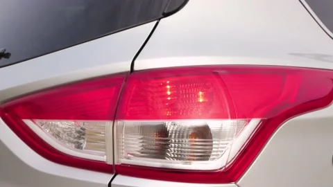 The yellow turn signal flashes and the red stop lights up. Stock Footage