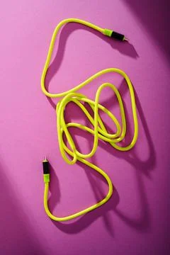 Yellow USB t Type C to USB Type C cable for fast data transfer. 스톡 사진