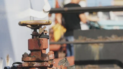 Yellow valve in thin red rusty pipes in sea ship. Machinery and equipment of  Stock-Footage 114625998