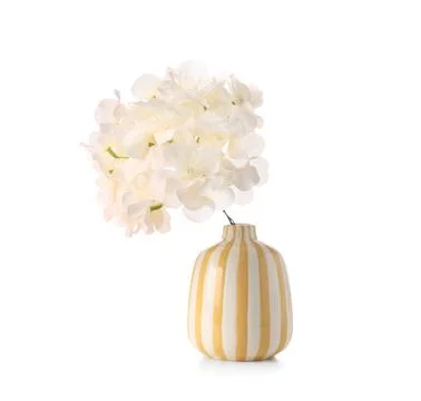 Yellow vase of beautiful artificial hydrangea flowers isolated on white backg Stock Photos