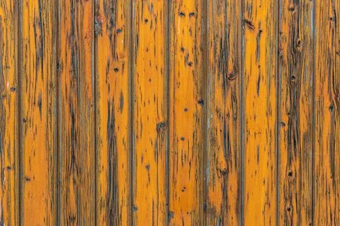 Yellow, vertically oriented planks with chipped yellow color. Fotos Stock