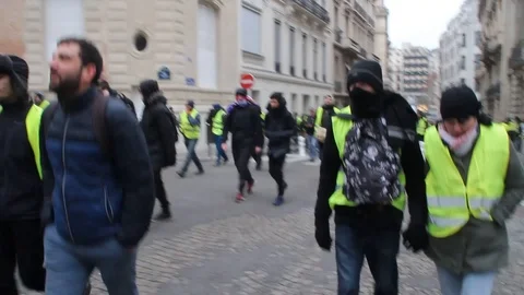 Yellow Vest protest at Champs Elysee and Place Charles de Gaulle Etoile - 2018 Stock Footage 102367190