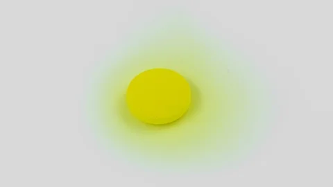 Yellow vitamin tablet dissolves in water. Timelapse, Macro. Stock Footage 127693561