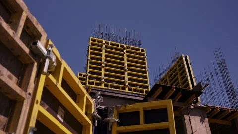 Yellow wall formwork and reinforcement at concrete building construction Stock Footage 346550059