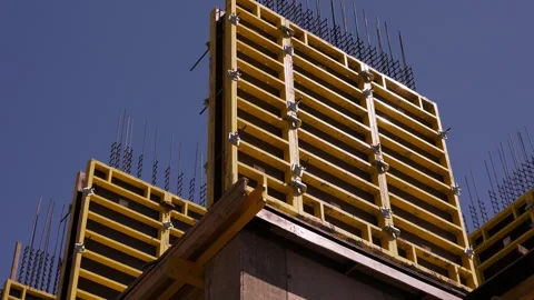 Yellow wall formwork installed for reinforced concrete construction Stock Footage 346551516