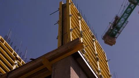 Yellow wall formwork installed for reinforced concrete construction 動画素材 347160822