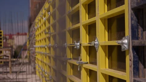 Yellow wall formwork panels installed for concrete construction 動画素材 347160173