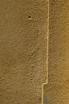 Yellow wall texture Stock Photos