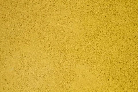 Yellow wall texture Stock Photos