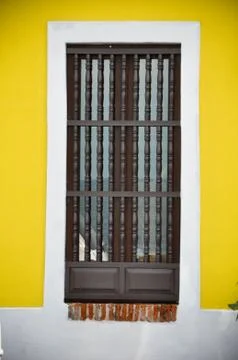 Yellow wall with window Stock Photos
