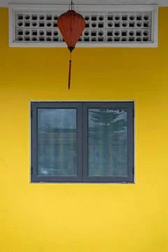 Yellow wall with window Stock Photos