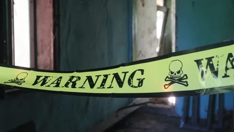 Yellow warning banner, restricted area, old house Stock Footage 247550130