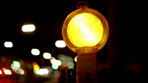 Yellow warning lamp blinking and informing the drivers about road construction Video stock 67676509