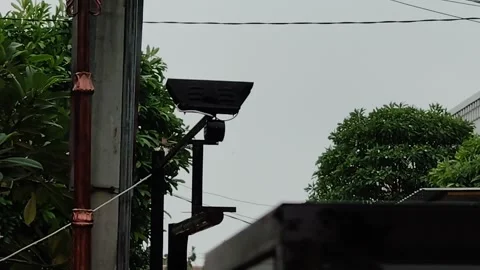 Yellow warning lights on the side of the road when it rains heavily Stock-Footage 273820424