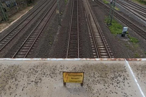 A yellow warning sign caution high voltage Stock Photos
