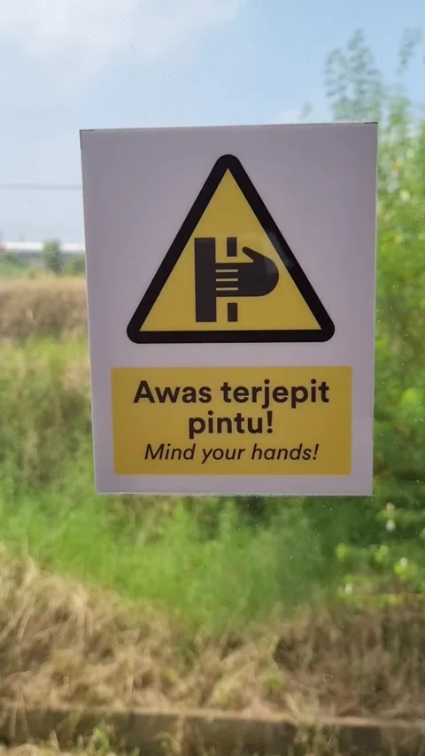 Yellow warning sign on a glass window Video stock 337402917