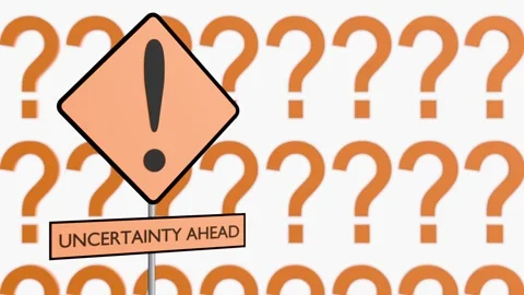 A Yellow Warning Sign with "UNCERTAINTY AHEAD" and Floating Question Marks Stock Footage 331404689
