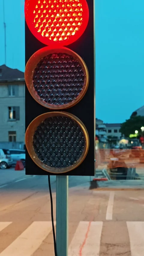 Yellow warning traffic light blinking at city pedestrian crosswalk during Stock Footage 334632475