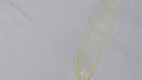 Yellow water drop on white fabric Stock Footage 131910848