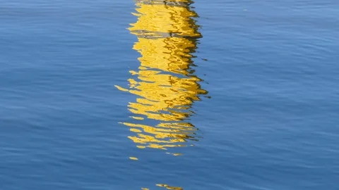 Yellow Water reflection, Blue Water surface Stock Footage 124364074