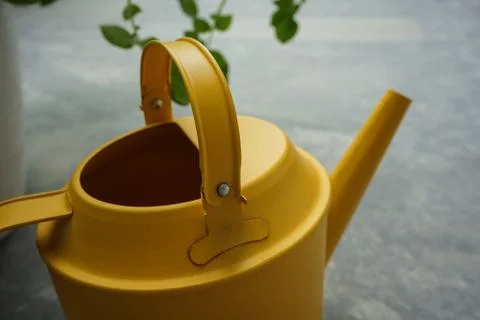 Yellow watering can Stock Photos