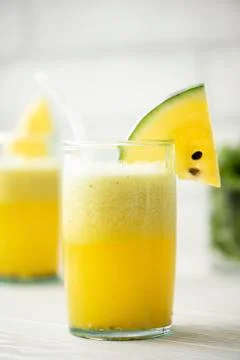 Yellow watermelon smoothie in large glasses Stock Photos