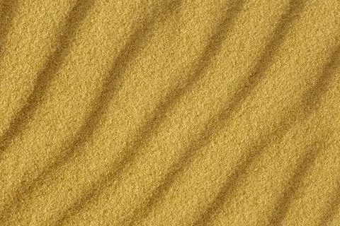 Yellow wavy sand texture close up, beautiful natural natural background for Foto stock
