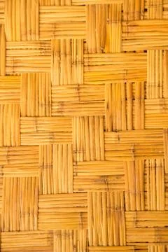 Yellow  weaved traiditional bamboo wicker background Stock Photos