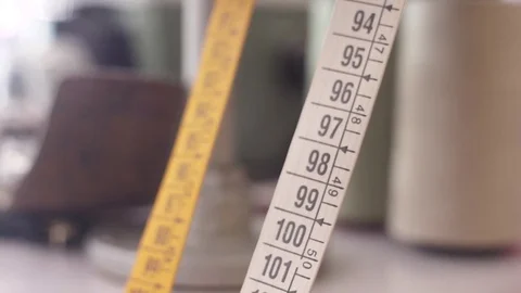 Yellow white  flexible ruler tape measure backround out of focus Vídeo Stock 78552933