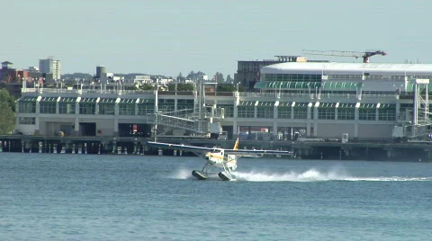 Yellow White Float Plane Gets Airborne Stock-Footage 829224