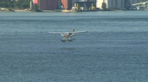 Yellow White Float Plane Lands 스톡 동영상 829098