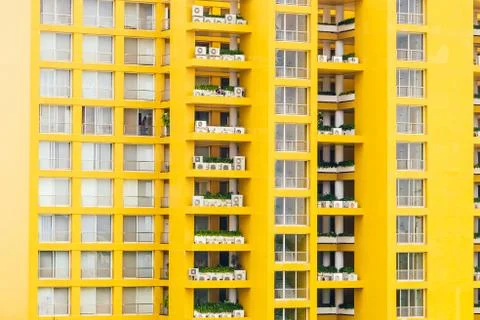 Yellow window pattern at apartment building - vintage filter Photos