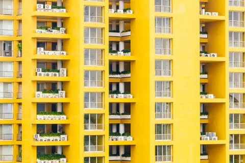Yellow window pattern at apartment building - vintage filter Photos